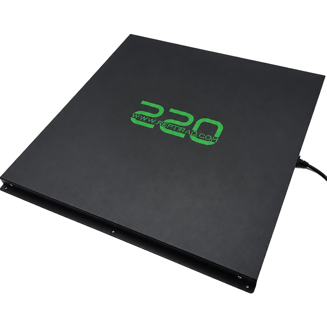 ReptiRad 220W heat panel at a three-quarter angle, showing its black casing, green branding, mounting flange and power cable.